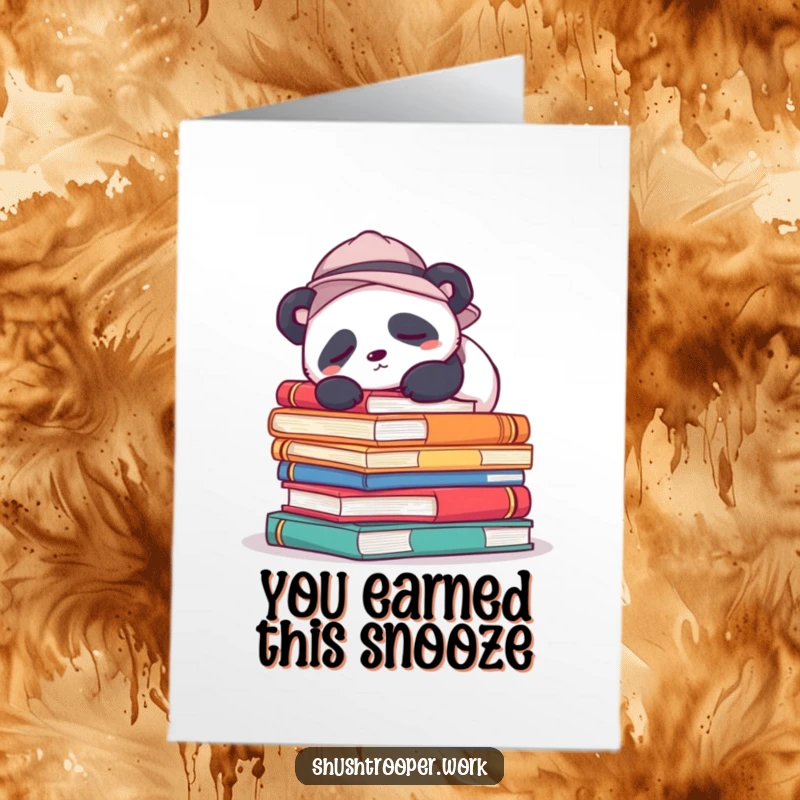 Free printable congratulations card featuring a sleepy panda in a hat snoozing on oversized books, a calm celebration.